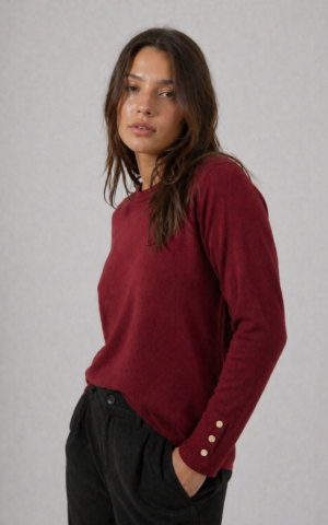 Sweater con broches puños